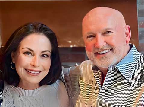 A smiling couple posing for a photo together