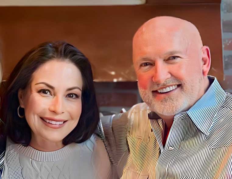 A smiling couple posing for a photo together